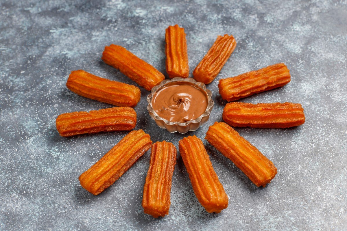 traditional mexican dessert churros with chocolate top view (1)