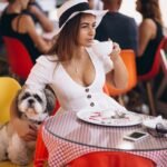 young lady bar with cute dog having lunch (1)